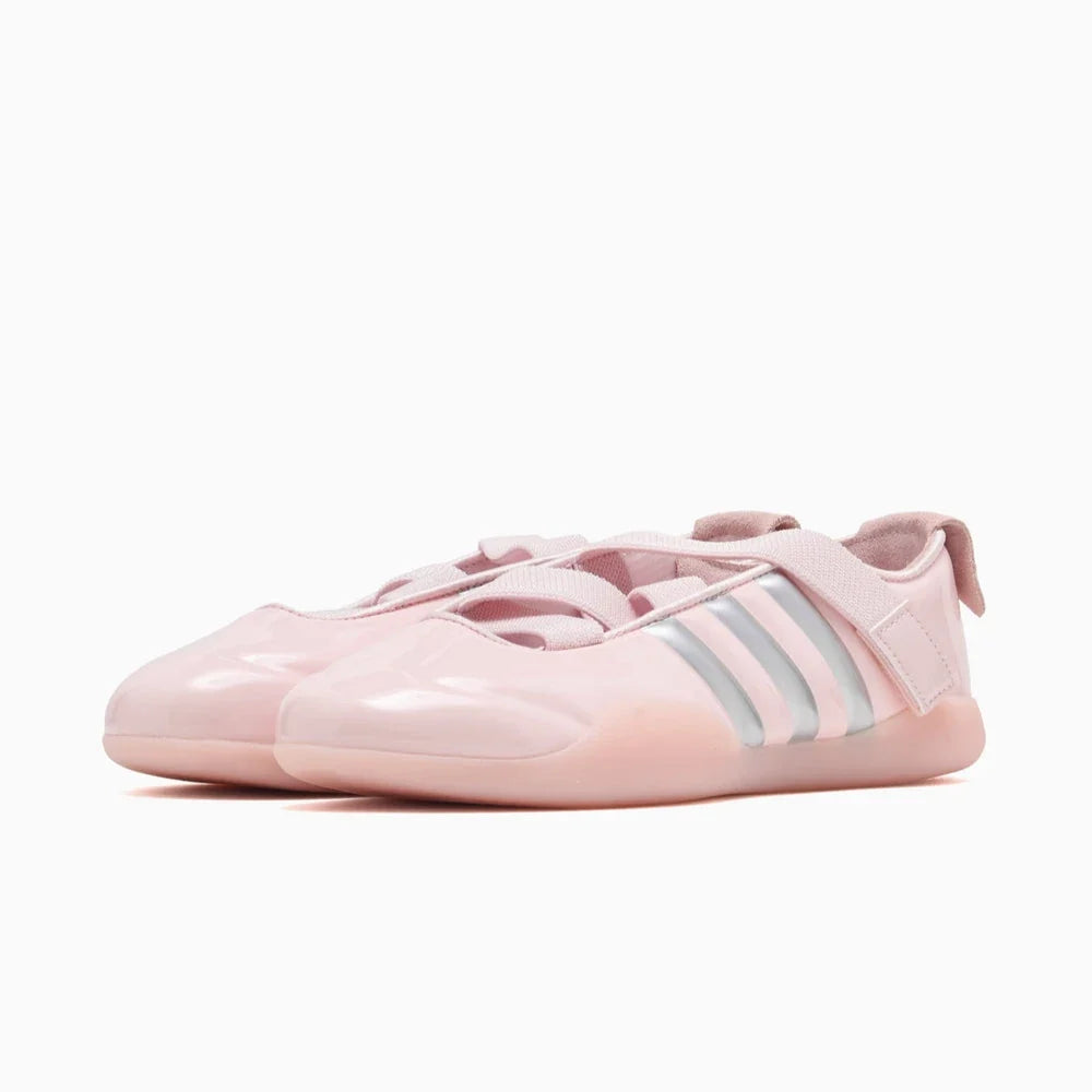 Adidas Clot Taekwondo Pink sneakers with silver stripes. 