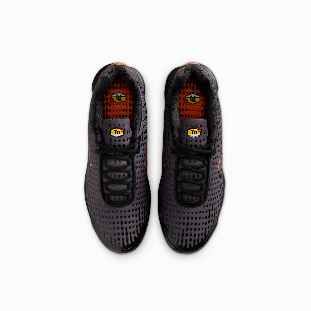 A pair of Nike Air Max plus VII running shoes in dark gray and black with orange accents, shown from a top-down view on a white background.