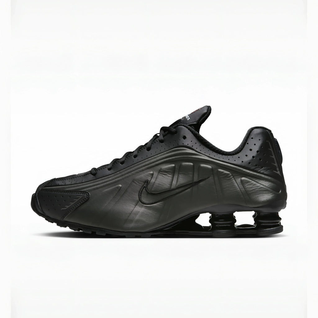 Triple Black nike shox r4 on a white background