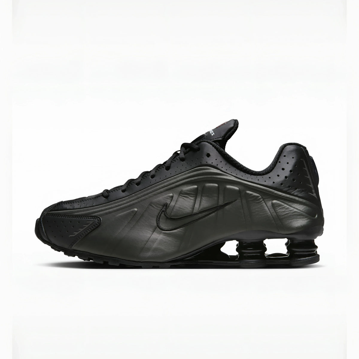 Triple Black nike shox r4 on a white background