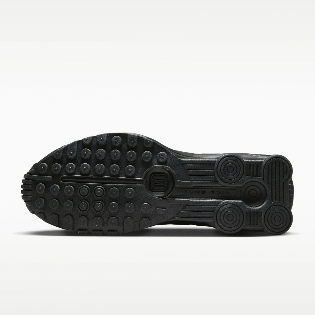 Black Nike shoe sole on a white background
