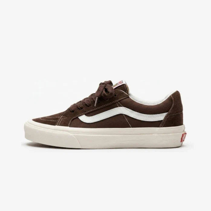 A single Vans Old Skool sneaker in dark brown suede with a white side stripe and a thick cream-colored rubber sole, shown from a side profile view against a light gray background.