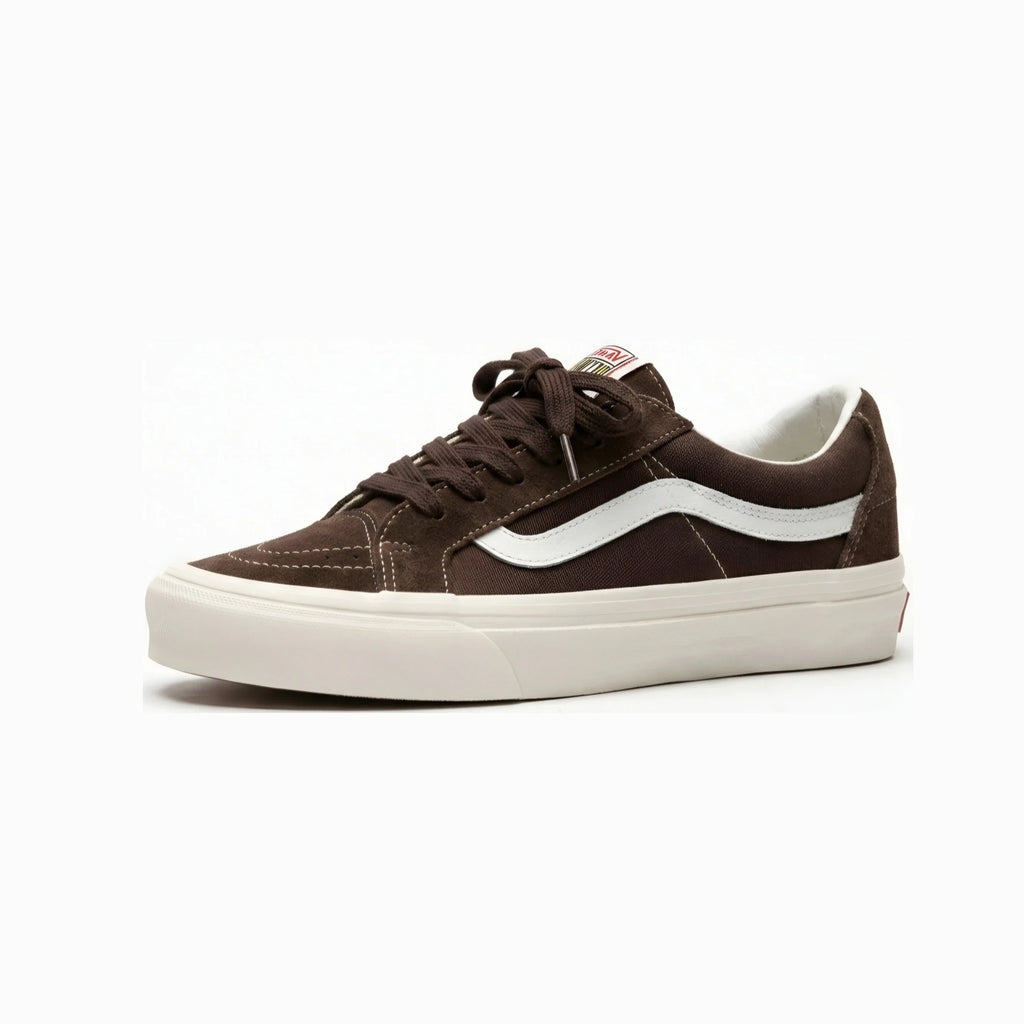 A dark brown suede Vans Old Skool sneaker with a white side stripe and a thick cream-colored rubber sole, shown from a side profile view on a white background.
