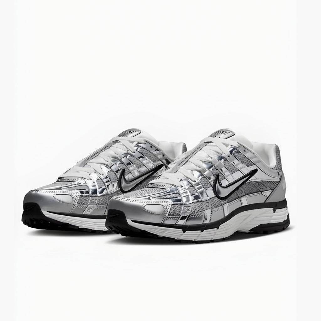 Pair of silver and black nike P6000 sneakers on a white background